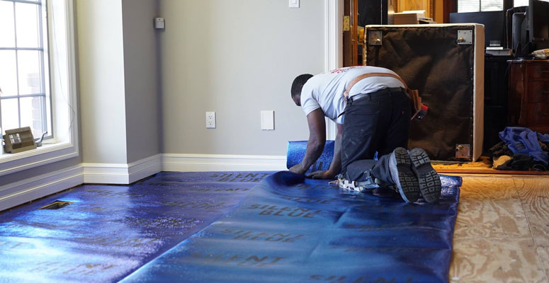 focused on installing carpet