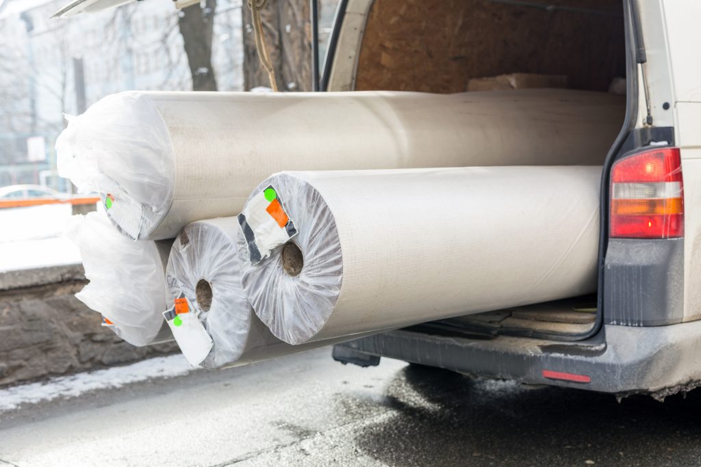 Carpet delivery van filled with customer installation carpet