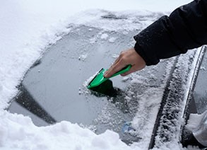 scraping a frozen car windshield