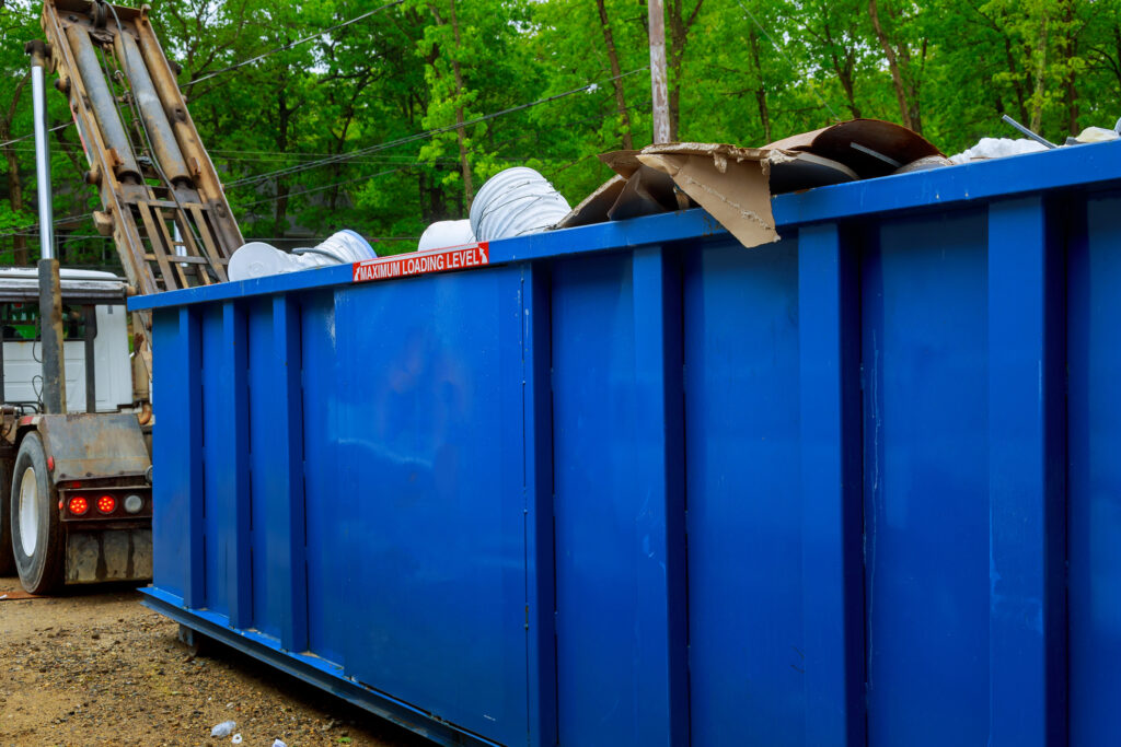 Dumpster clean up full of construction materials