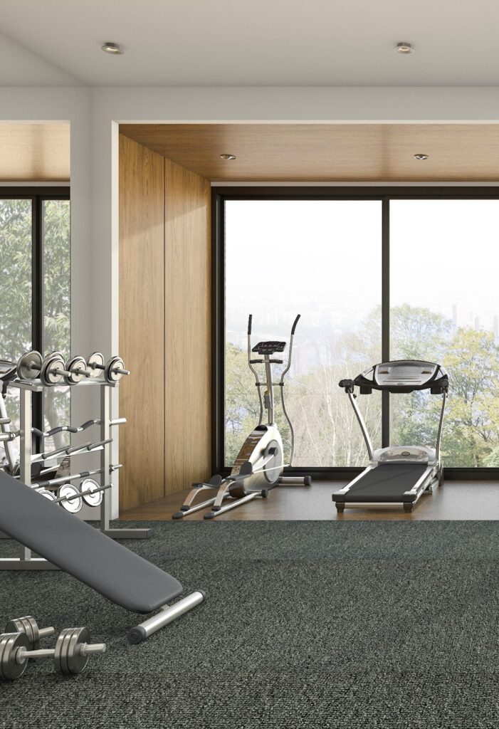 upscale home gym with laminate and carpet tiles
