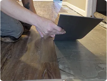 Vinyl Flooring Installer Being Installed